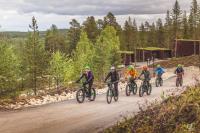 biking-to-campfire-at-arctic-treehouse-hotel-in-rovaniemi-by-johannes-rolloutdoors.jpg